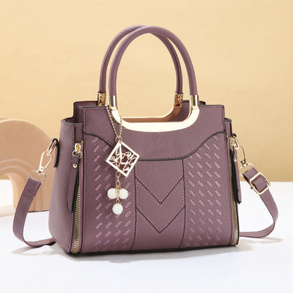 DESCONTO DE 50% POR TEMPO LIMITADO! ✨ Mala feminina com costura em V – Detalhes dourados, vários compartimentos, alça superior 🌸