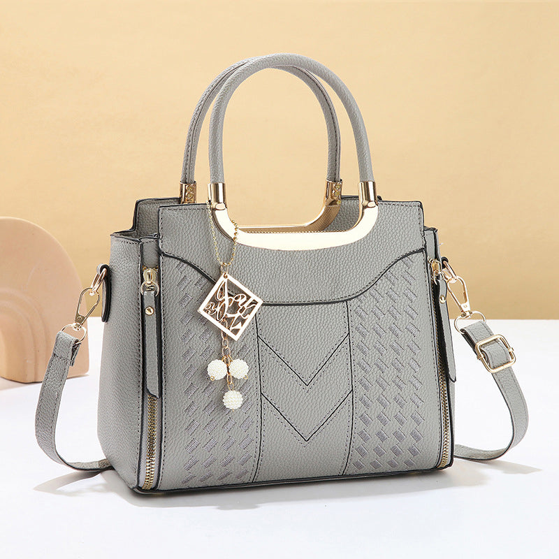 DESCONTO DE 50% POR TEMPO LIMITADO! ✨ Mala feminina com costura em V – Detalhes dourados, vários compartimentos, alça superior 🌸